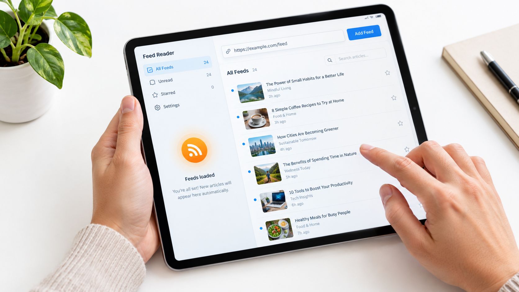 A person using a tablet to view an RSS feed reader app with various news articles displayed.